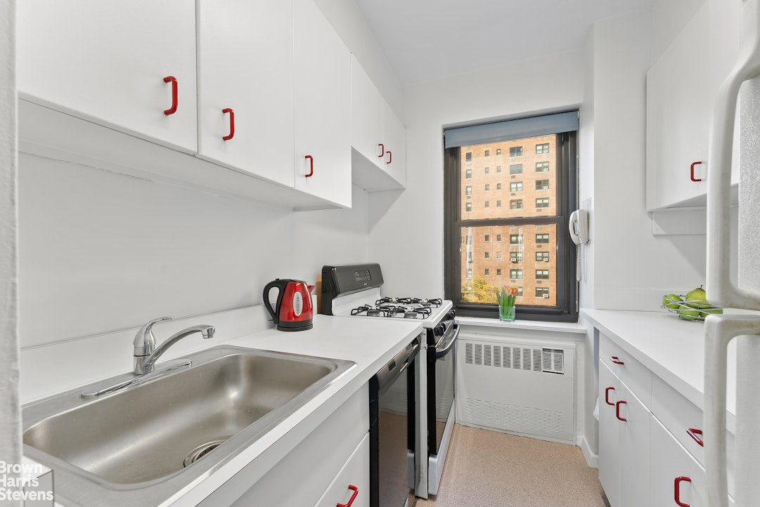 11 Riverside Drive, Unit 10PE Manhattan, NY 10023 - Photo 7 of 15 a utility room with a sink a window and appliances