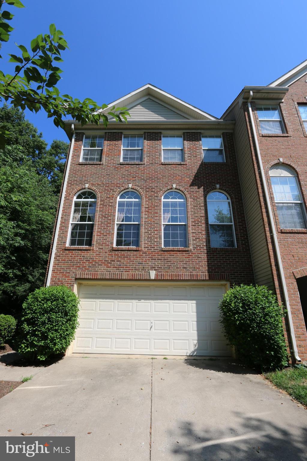 18100 Truffle Lane Boyds, MD 20841 - Photo 1 of 39 a front view of a house with a yard