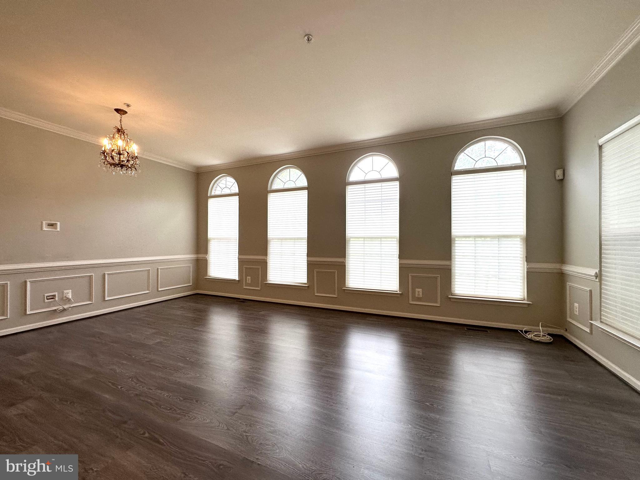 18100 Truffle Lane Boyds, MD 20841 - Photo 11 of 39 a view of an empty room with wooden floor and a large window