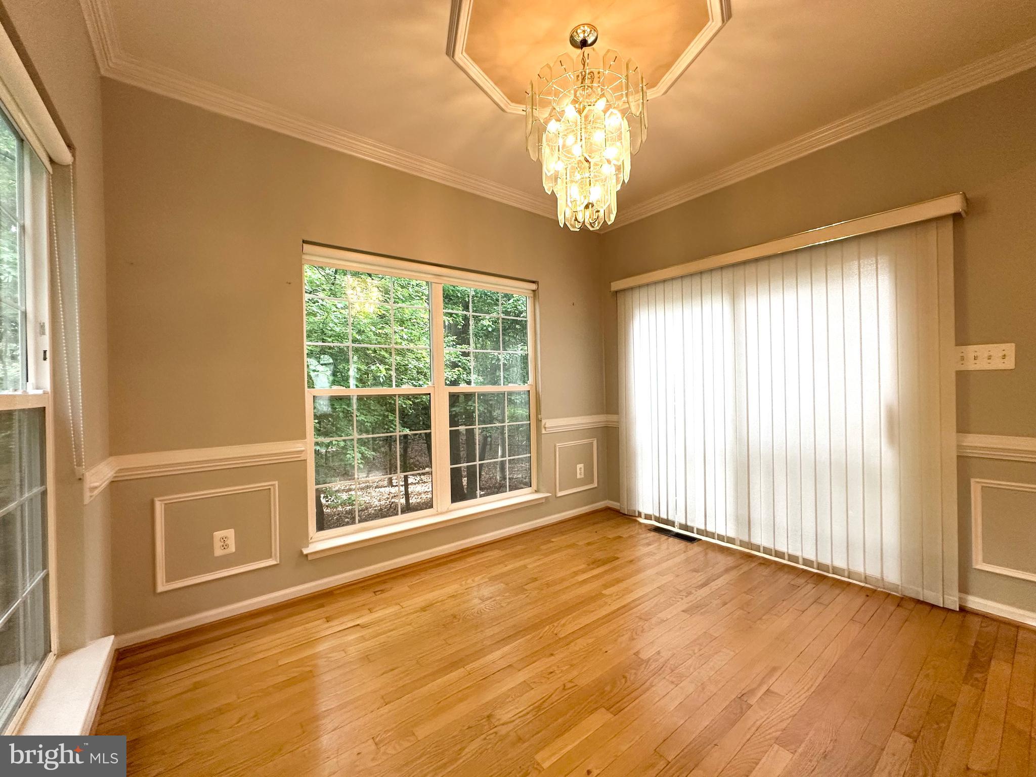 18100 Truffle Lane Boyds, MD 20841 - Photo 14 of 39 a view of an empty room with wooden floor and a window
