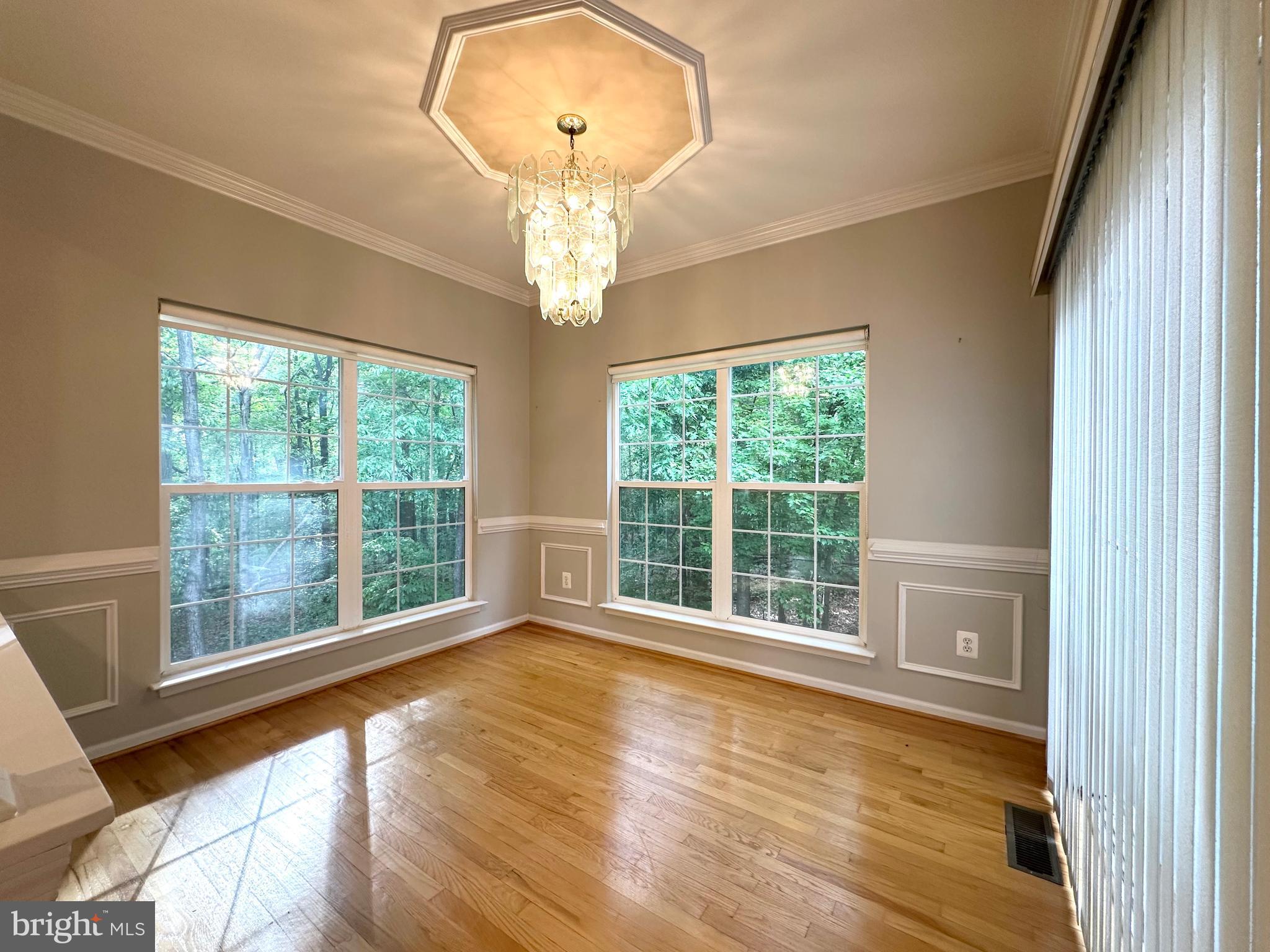 18100 Truffle Lane Boyds, MD 20841 - Photo 17 of 39 a view of an empty room with wooden floor and a window