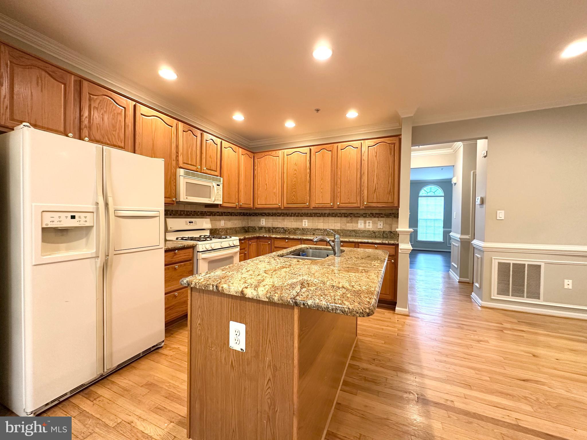 18100 Truffle Lane Boyds, MD 20841 - Photo 20 of 39 a kitchen with stainless steel appliances granite countertop refrigerator sink and cabinets