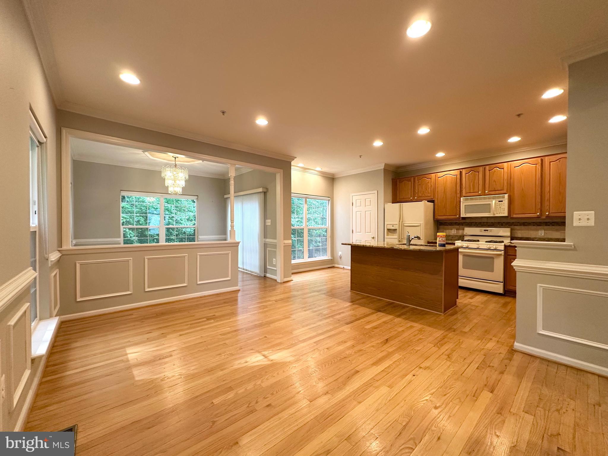 18100 Truffle Lane Boyds, MD 20841 - Photo 23 of 39 a view of kitchen with kitchen island wooden floors wooden cabinets and stainless steel appliances