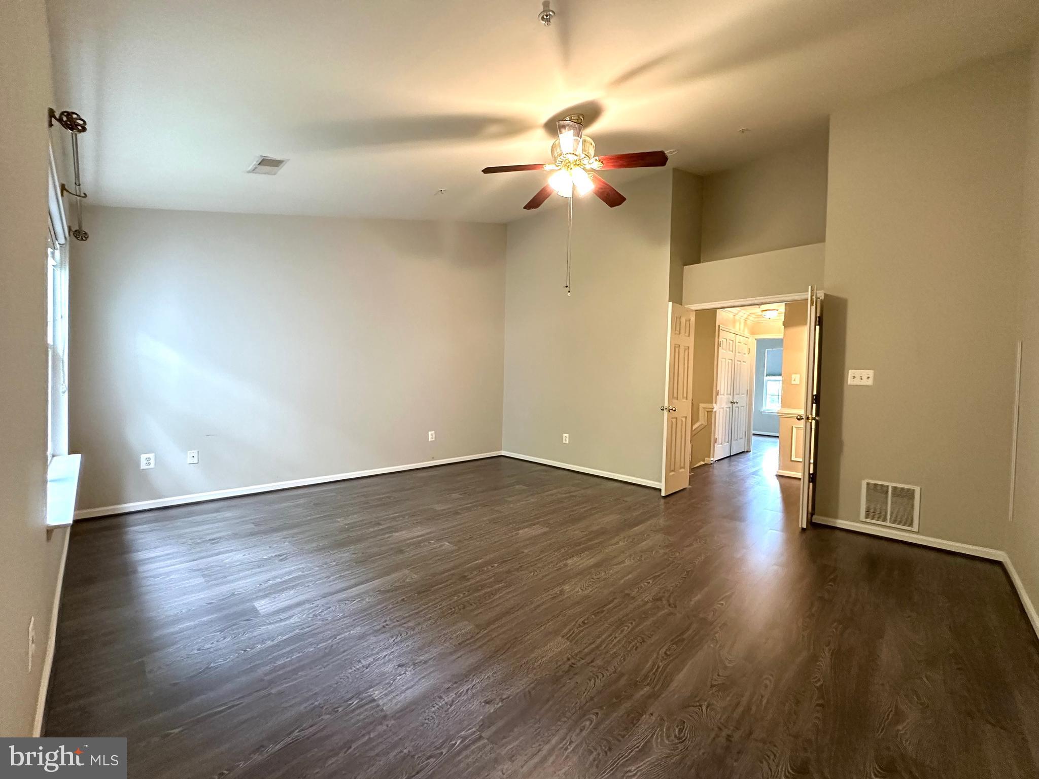 18100 Truffle Lane Boyds, MD 20841 - Photo 25 of 39 a view of an empty room with wooden floor and a window