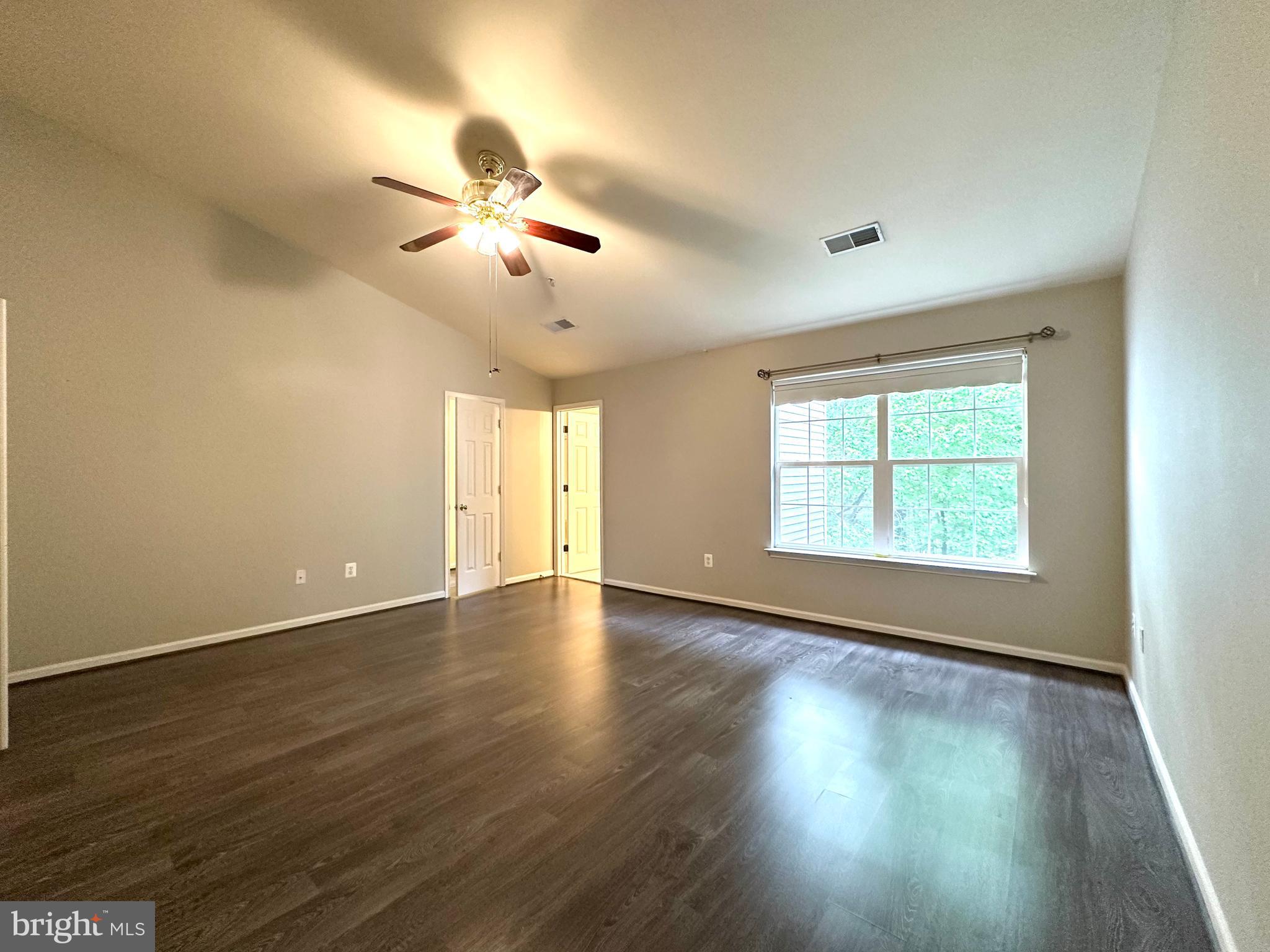 18100 Truffle Lane Boyds, MD 20841 - Photo 27 of 39 a view of an empty room with wooden floor and a window