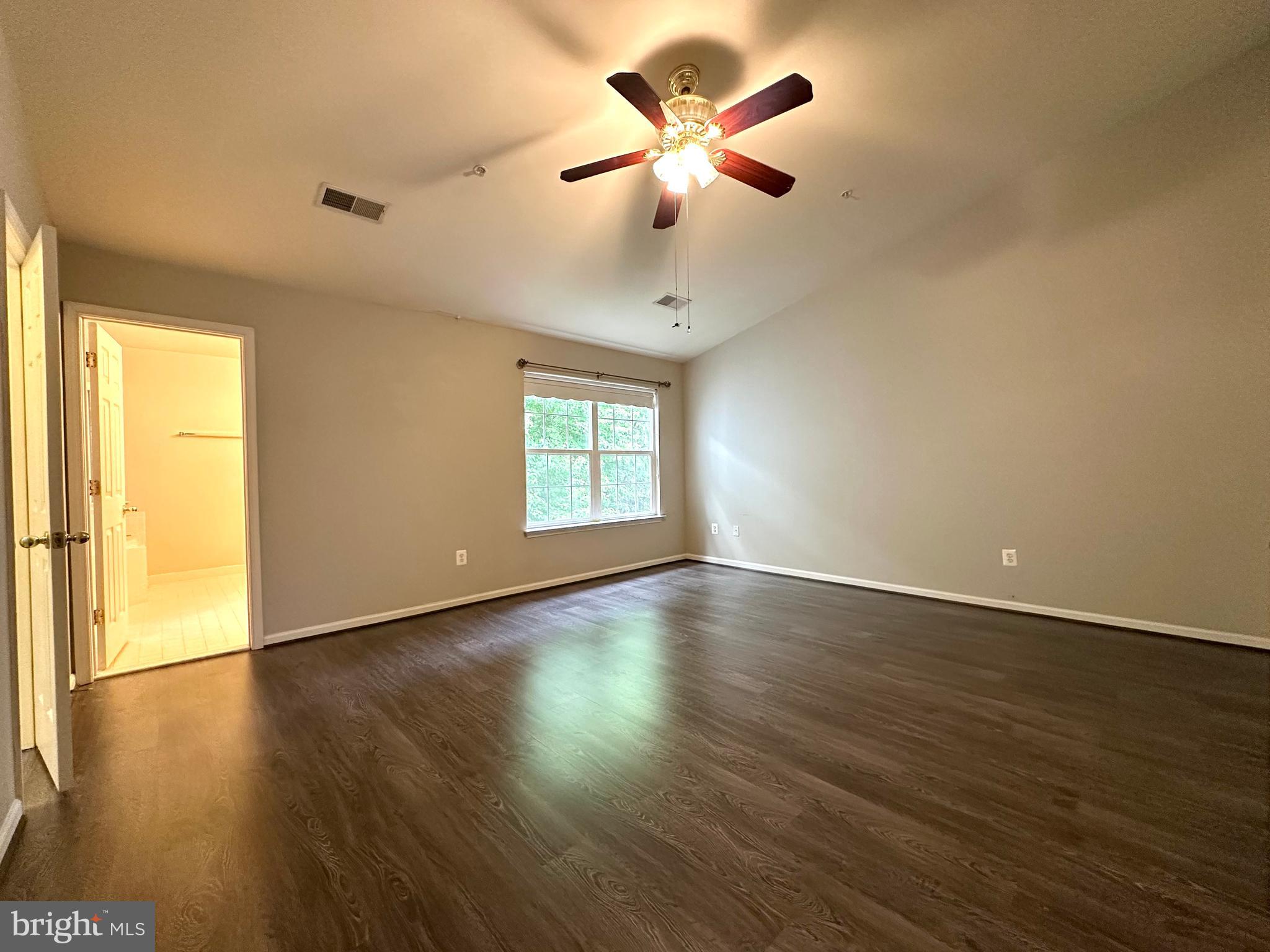 18100 Truffle Lane Boyds, MD 20841 - Photo 28 of 39 a view of an empty room with wooden floor and a window