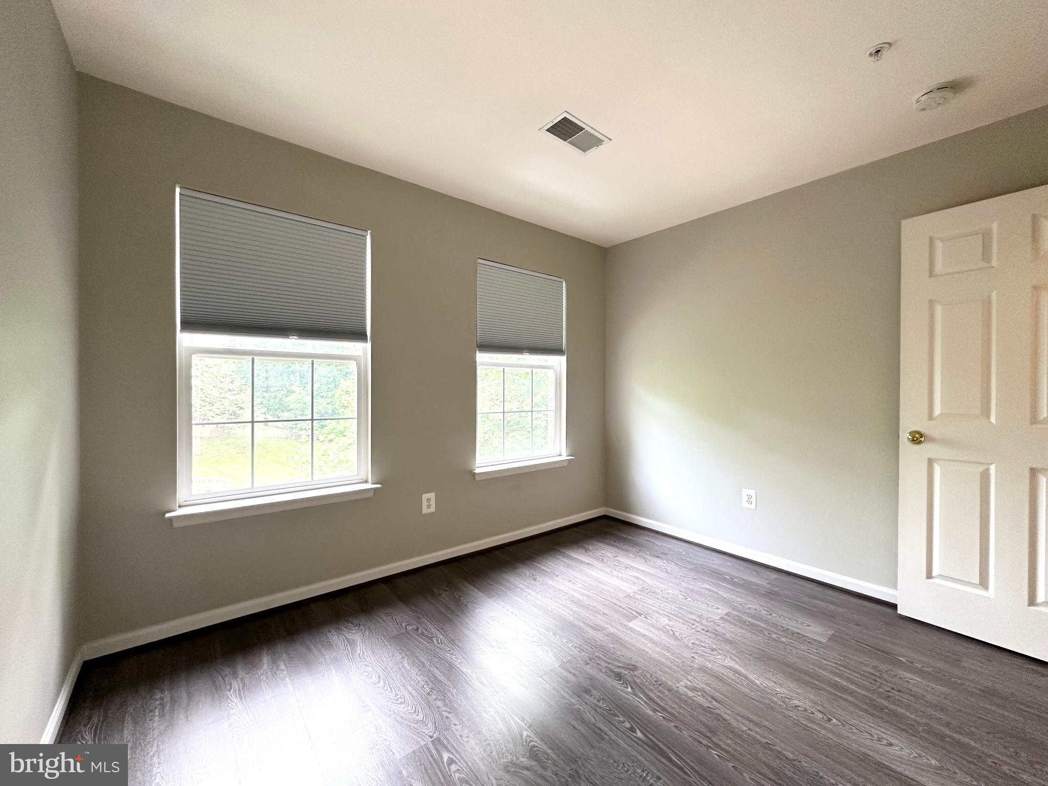 18100 Truffle Lane Boyds, MD 20841 - Photo 31 of 39 a view of an empty room with wooden floor and a window