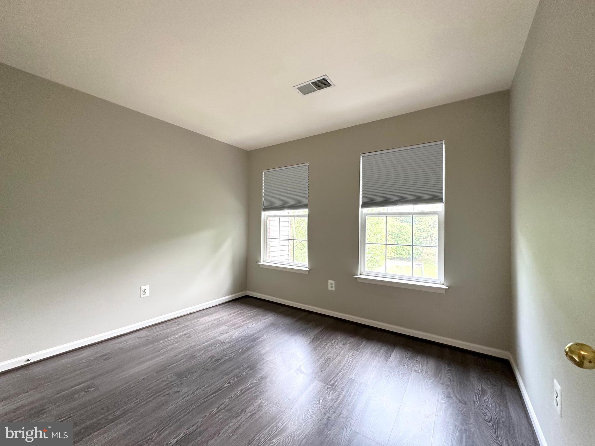 18100 Truffle Lane Boyds, MD 20841 - Photo 33 of 39 an empty room with wooden floor and windows
