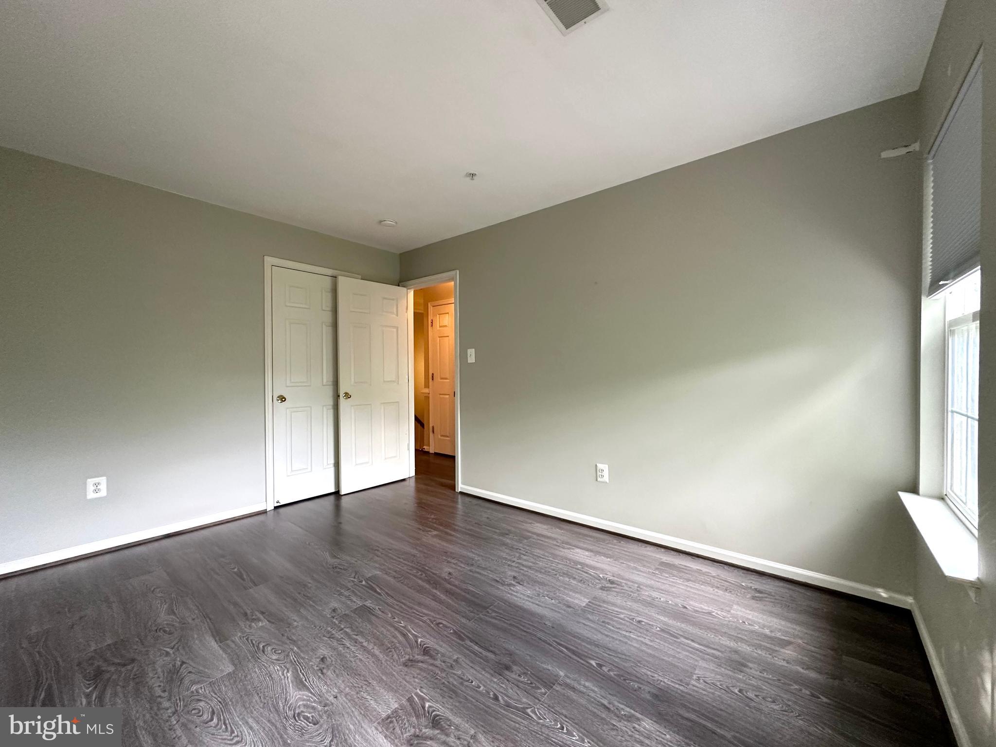 18100 Truffle Lane Boyds, MD 20841 - Photo 34 of 39 a view of an empty room with wooden floor and a window