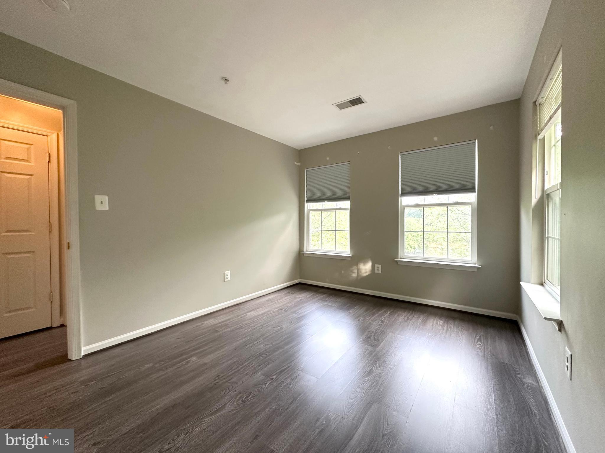 18100 Truffle Lane Boyds, MD 20841 - Photo 35 of 39 an empty room with wooden floor and windows