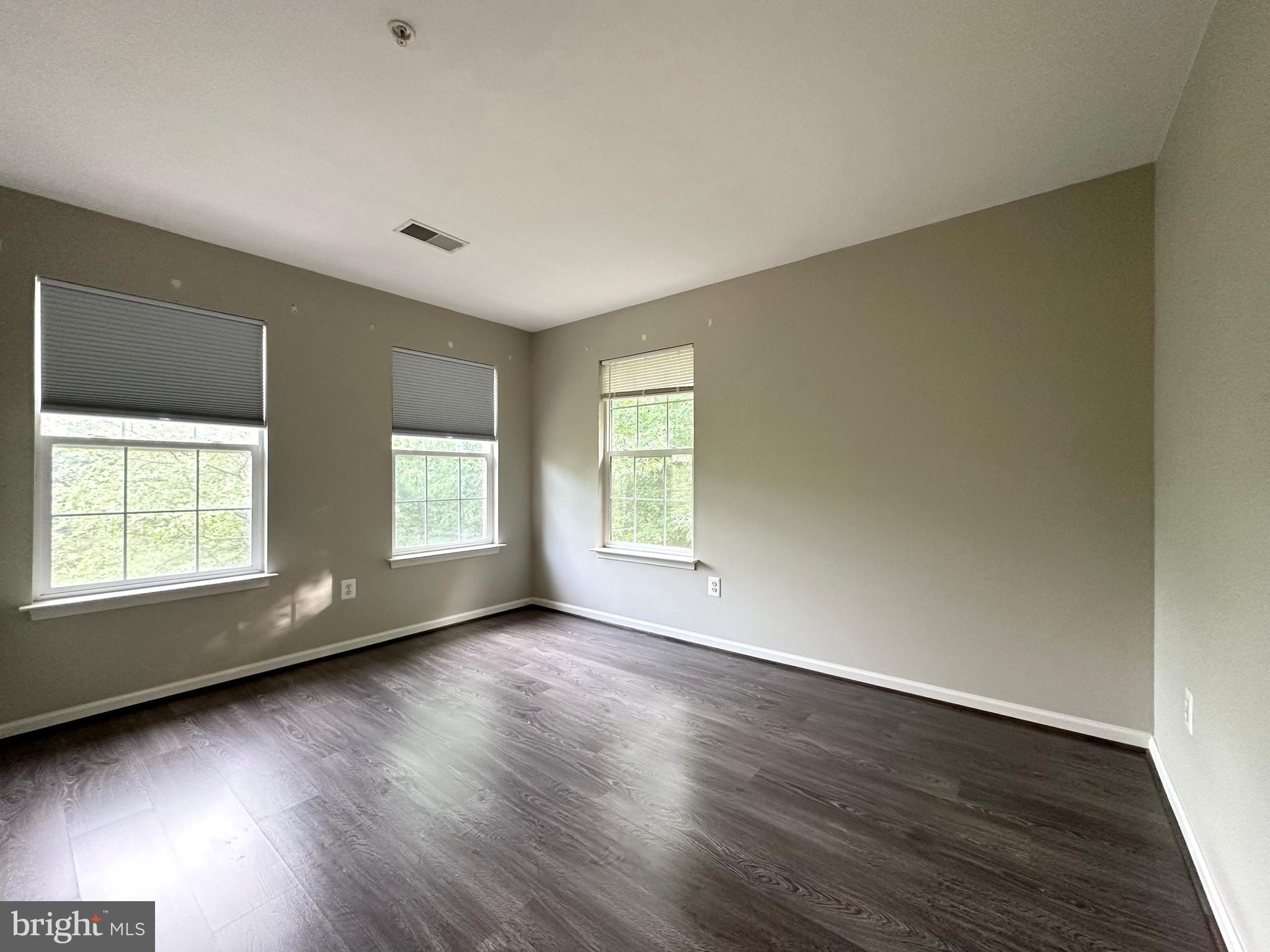 18100 Truffle Lane Boyds, MD 20841 - Photo 36 of 39 an empty room with wooden floor and windows