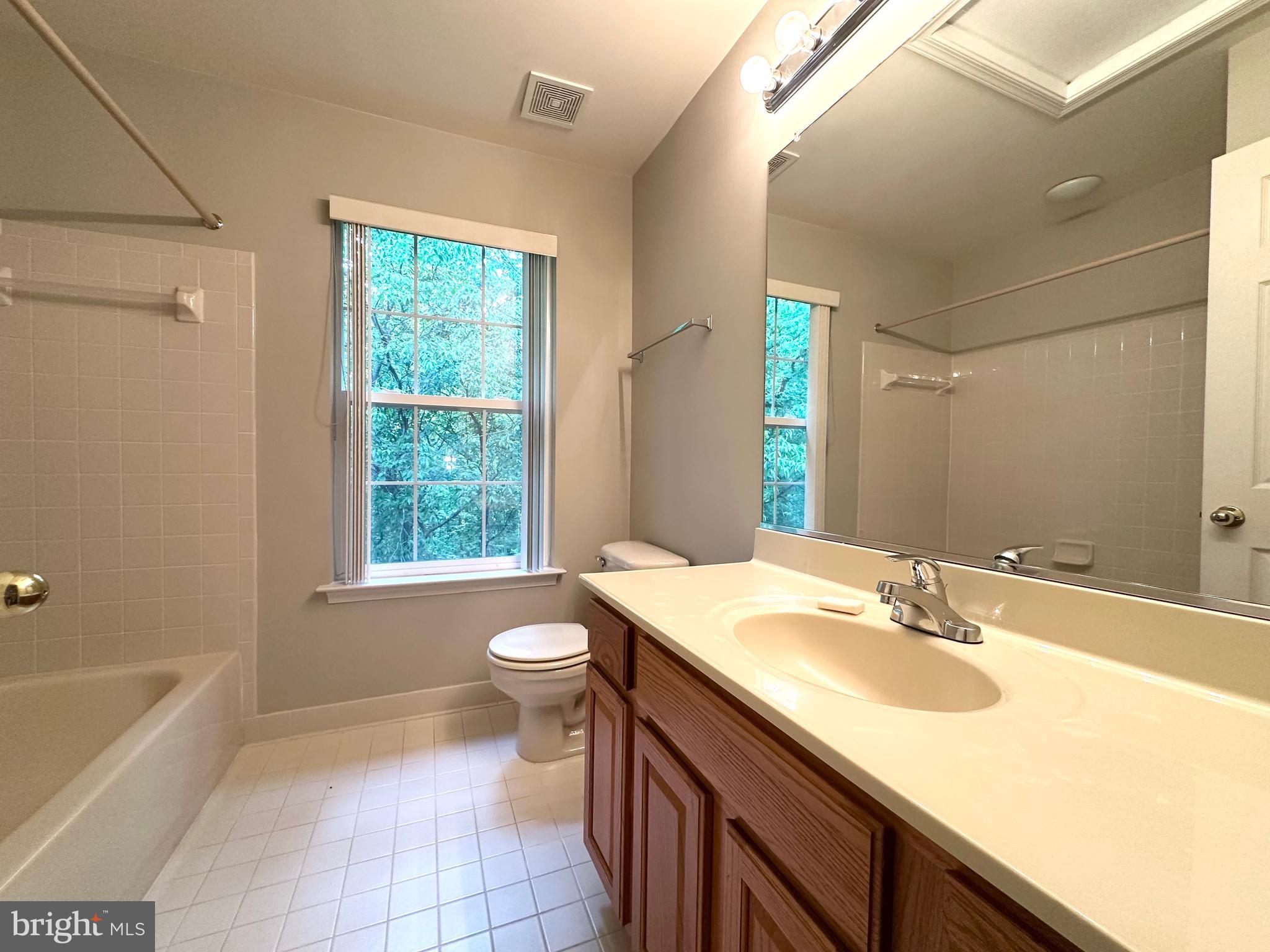 18100 Truffle Lane Boyds, MD 20841 - Photo 37 of 39 a bathroom with a granite countertop sink toilet and bathtub