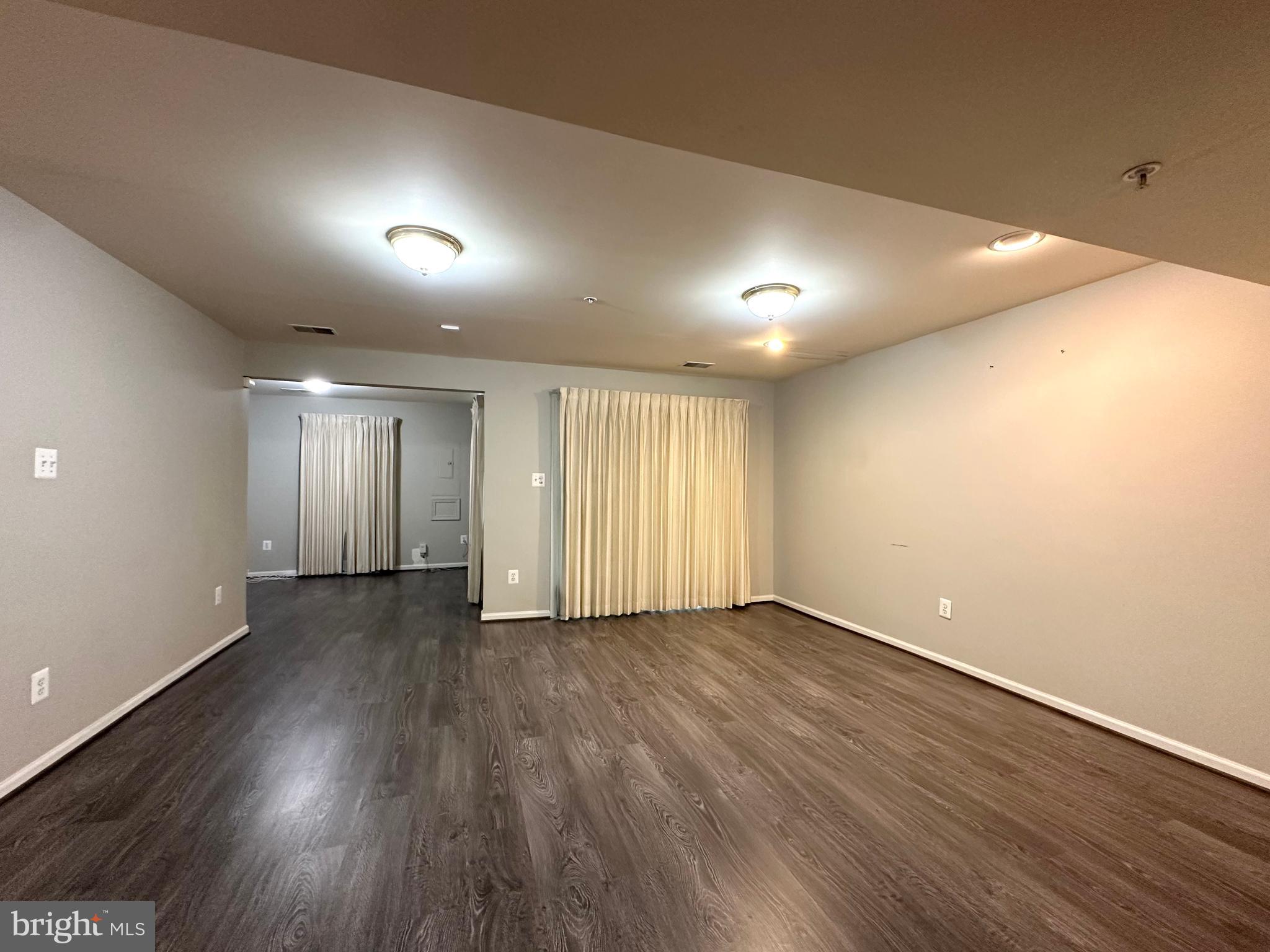 18100 Truffle Lane Boyds, MD 20841 - Photo 4 of 39 an empty room with wooden floor and windows