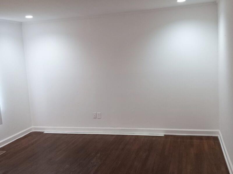 3545 Orchard Street Clarkston, GA 30021 - Photo 6 of 13 a view of an empty room with wooden floor and a window