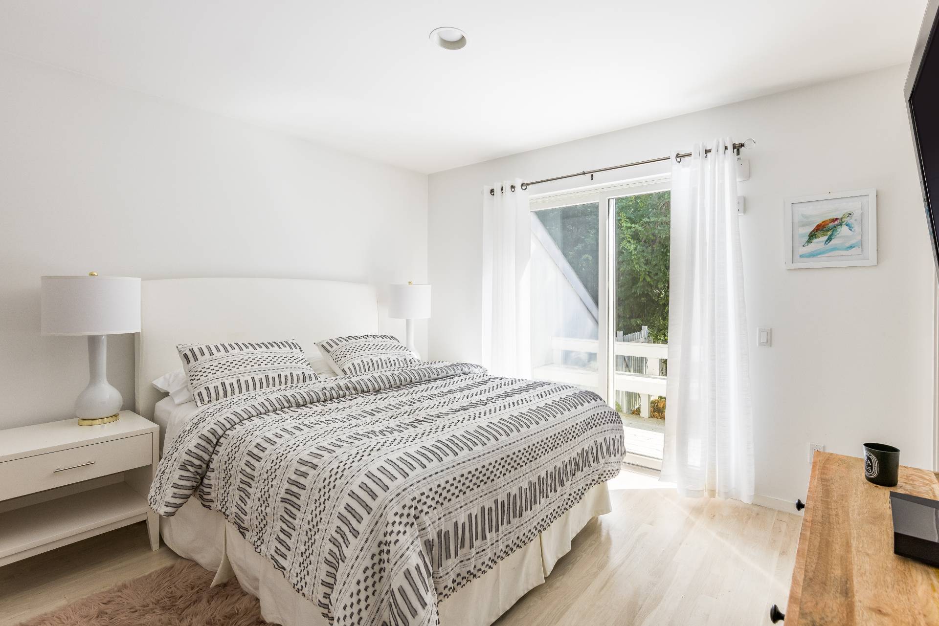 52 Bull Path East Hampton, NY 11937 - Photo 13 of 24 a bedroom with a bed and a window