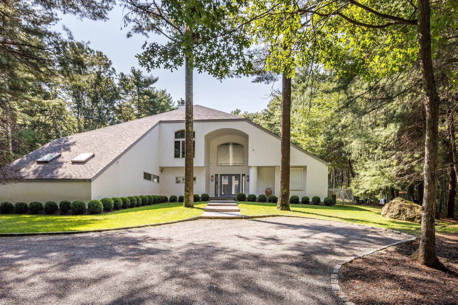 52 Bull Path East Hampton, NY 11937 - Photo 24 of 24 a view of pool with garden and trees