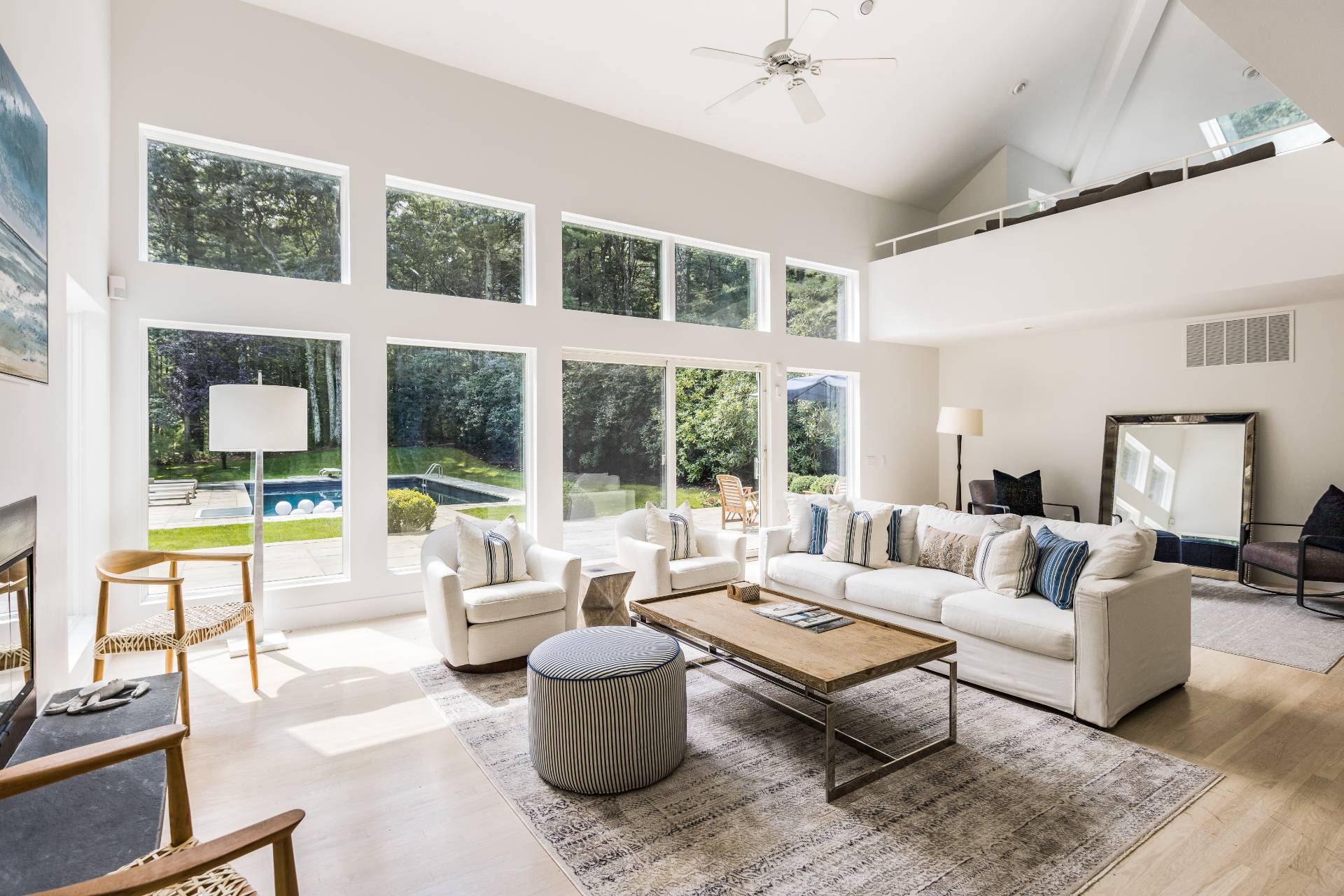 52 Bull Path East Hampton, NY 11937 - Photo 5 of 24 a living room with furniture and a floor to ceiling window
