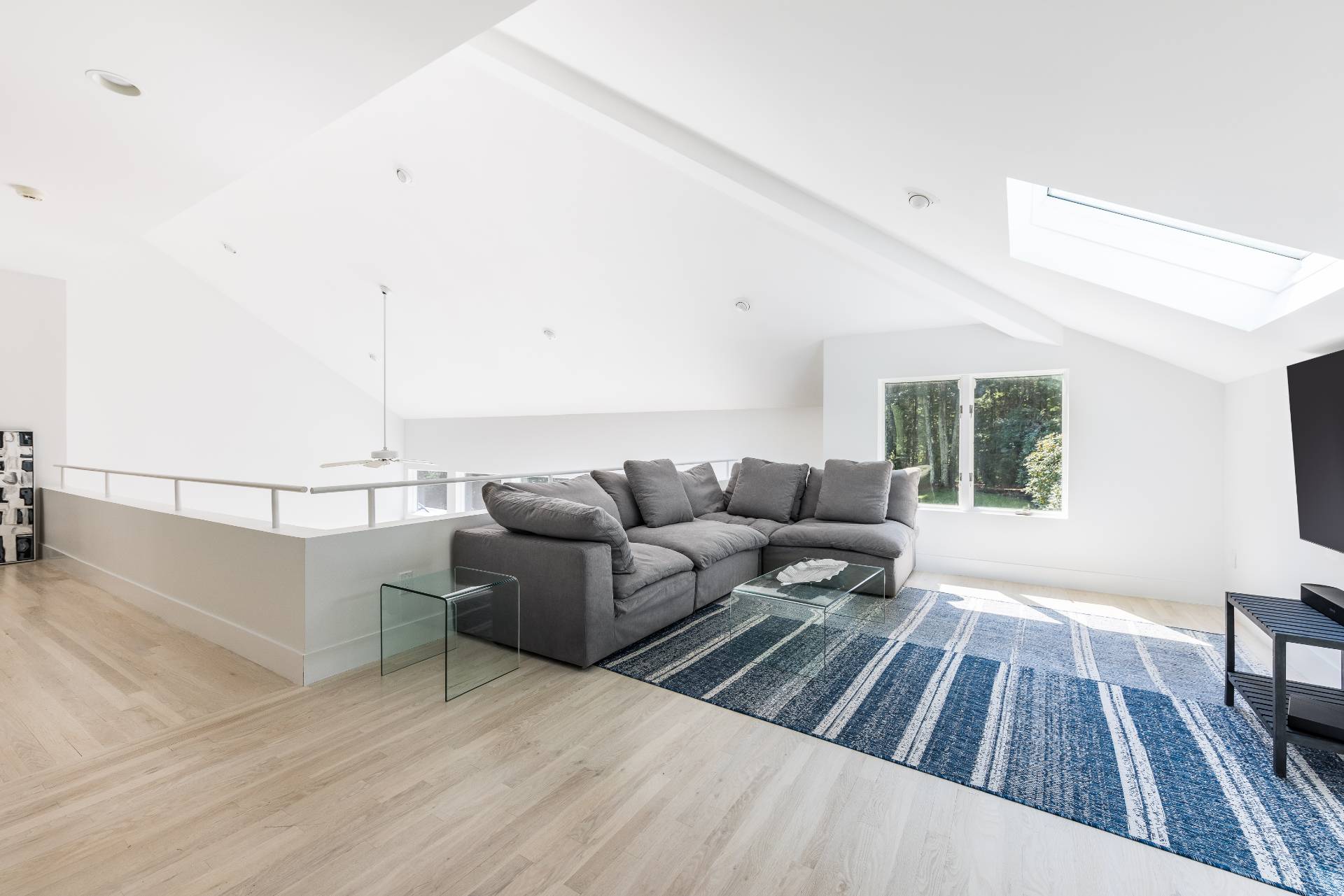 52 Bull Path East Hampton, NY 11937 - Photo 10 of 24 a living room with furniture and a wooden floor