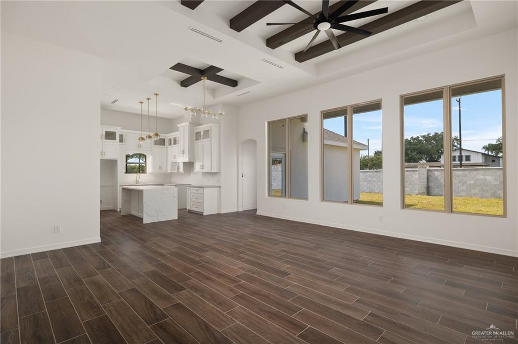 4805 Baylor Avenue McAllen, TX 78504 - Photo 3 of 14 a view of a kitchen with a sink hardwood floor and a ceiling fan