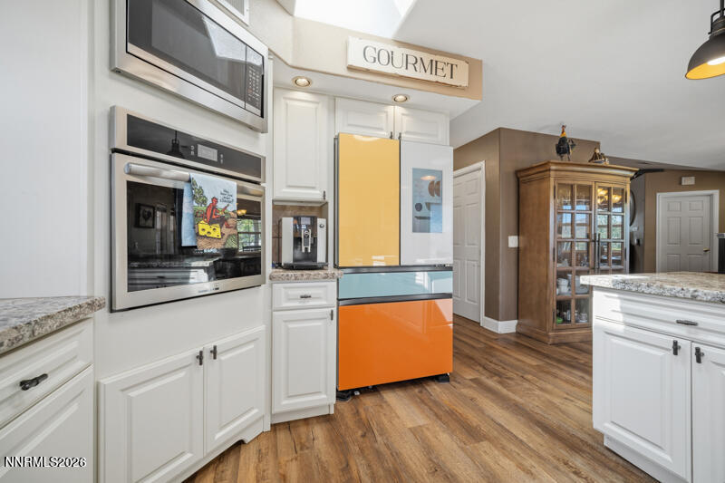 1931 Lousetown Road Reno, NV 89521 - Photo 9 of 51 a kitchen with stainless steel appliances granite countertop a stove and a refrigerator