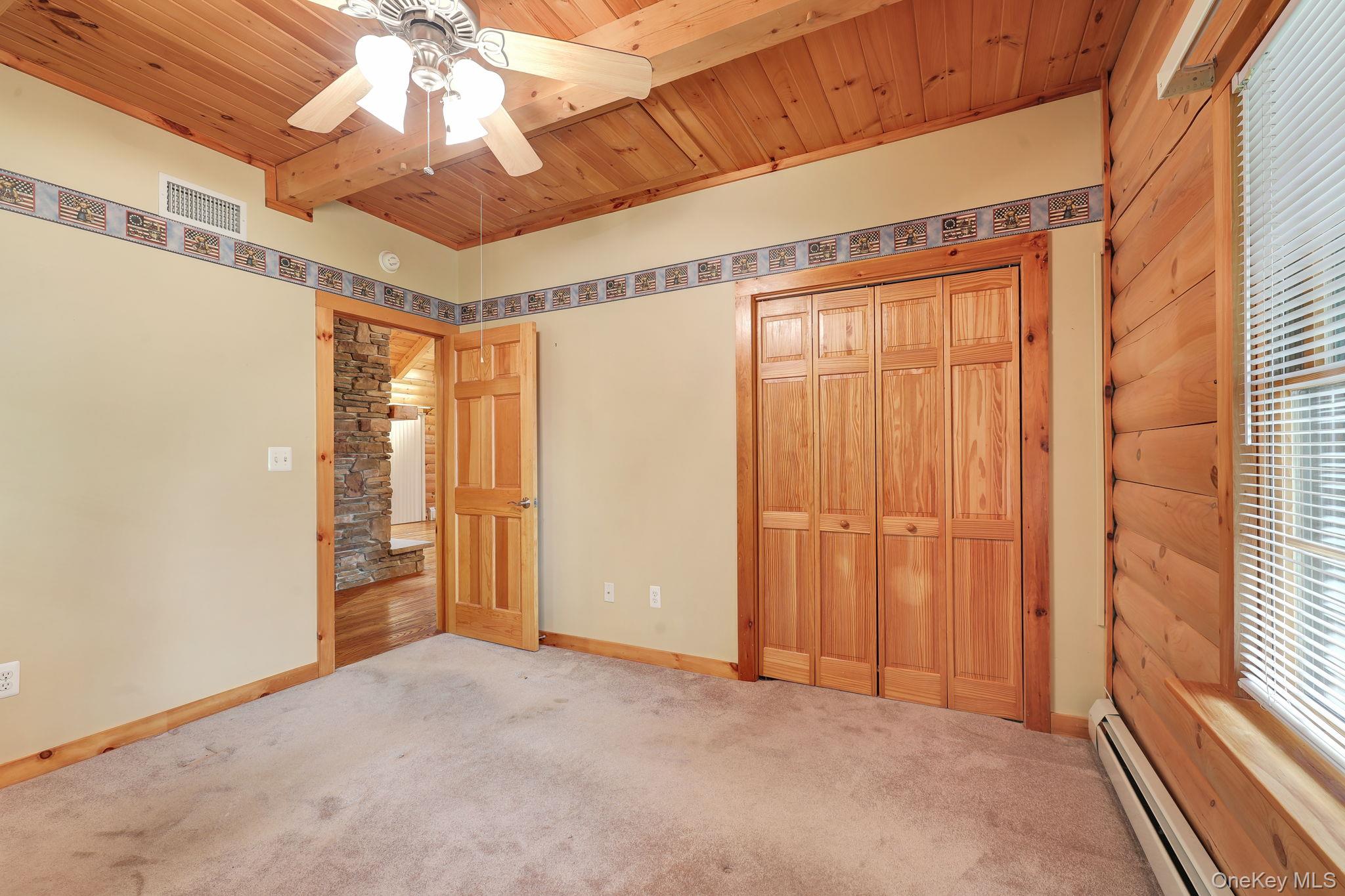 230 Post Road Slate Hill, NY 10973 - Photo 19 of 26 Alternate view of the bedroom shows the double door closet and the ceiling light/fan.