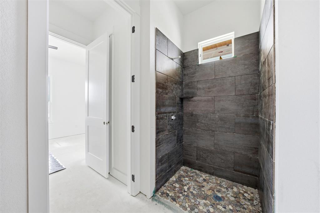 496 Willow Moon Ranch Road Crawford, TX 76638 - Photo 5 of 16 a bathroom with a shower