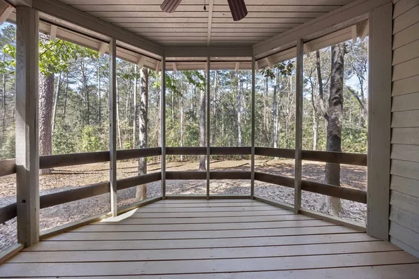 a view of a room with wooden floor and city view