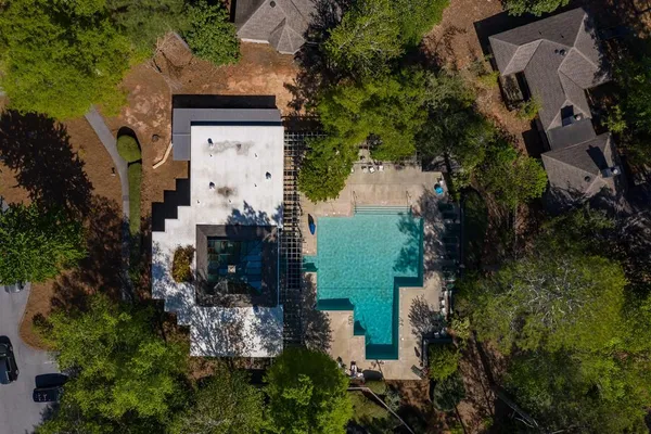 an aerial view of a house with outdoor space