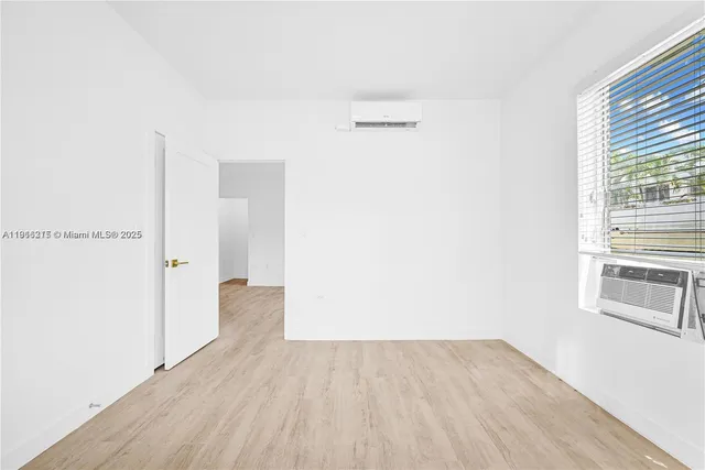 a view of a kitchen with wooden floor