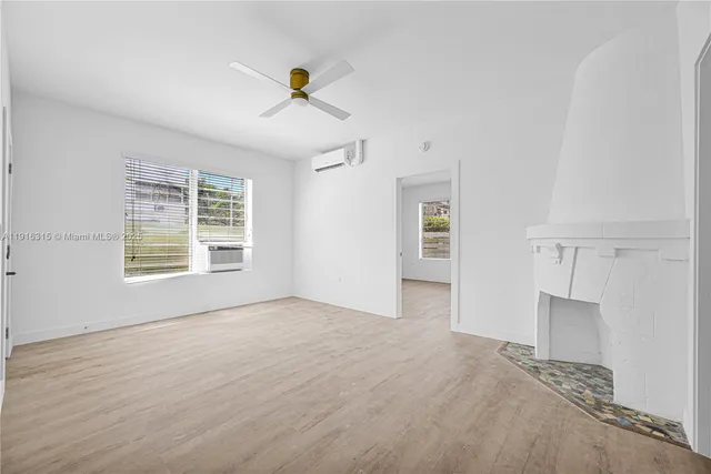 a view of an empty room with a window