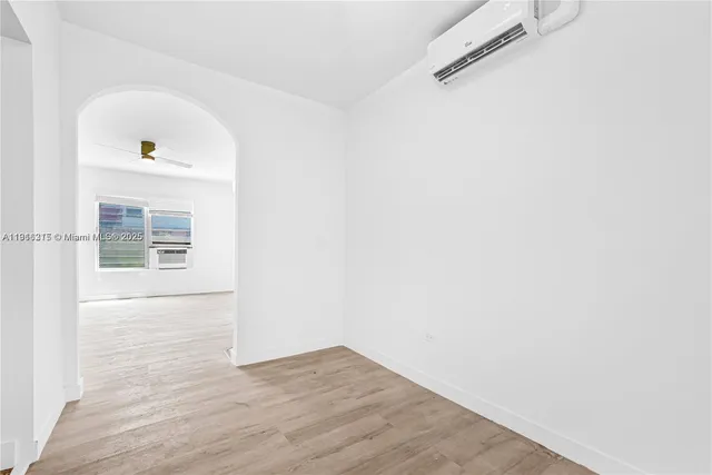 a view of hallway with wooden floor