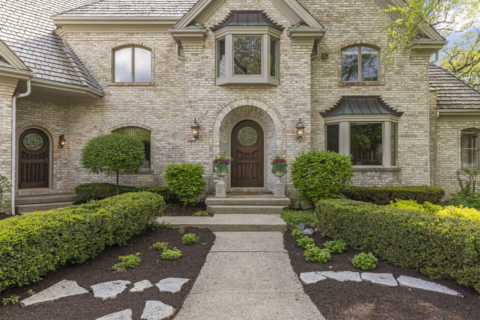 1S151 Winfield Road Wheaton, IL 60189 - Photo 5 of 73 a front view of a house with garden