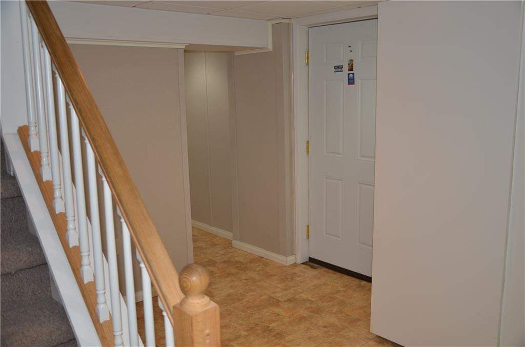 747 Charles Street Rochester, PA 15074 - Photo 18 of 23 Basement is not large, but finished. wall system is removable insulated panels.