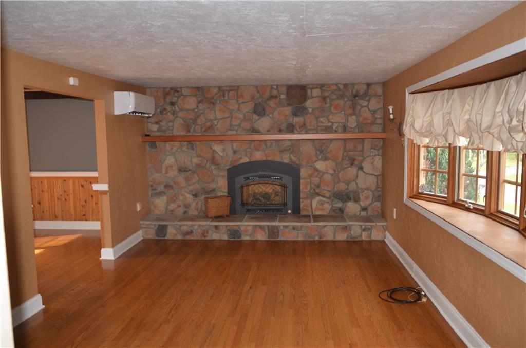 747 Charles Street Rochester, PA 15074 - Photo 7 of 23 Living room with Propane fireplace and large Pella Bow-bay window