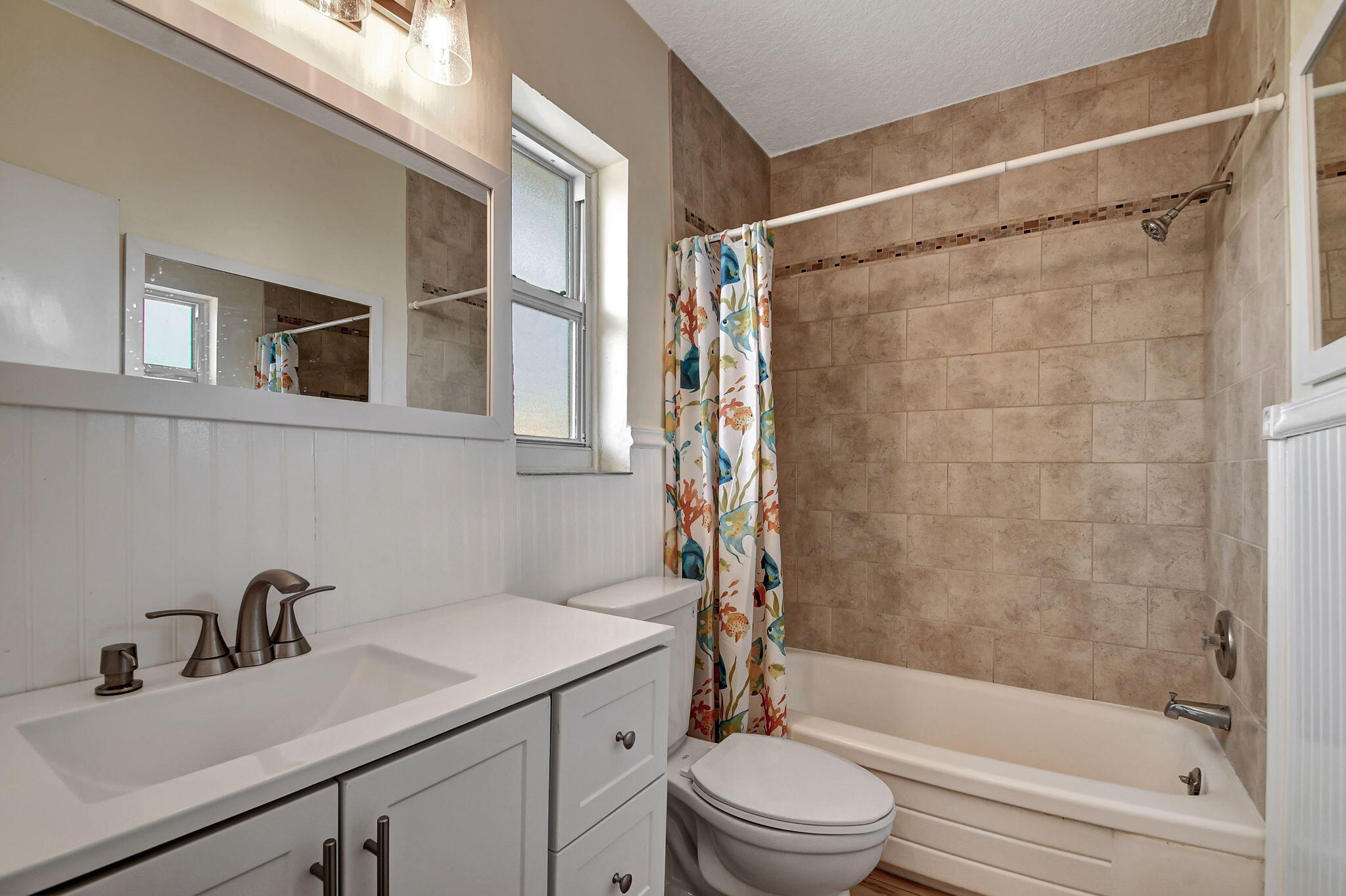 6520 North Ocean Boulevard, Unit 30 Ocean Ridge, FL 33435 - Photo 11 of 29 a bathroom with a sink toilet and shower