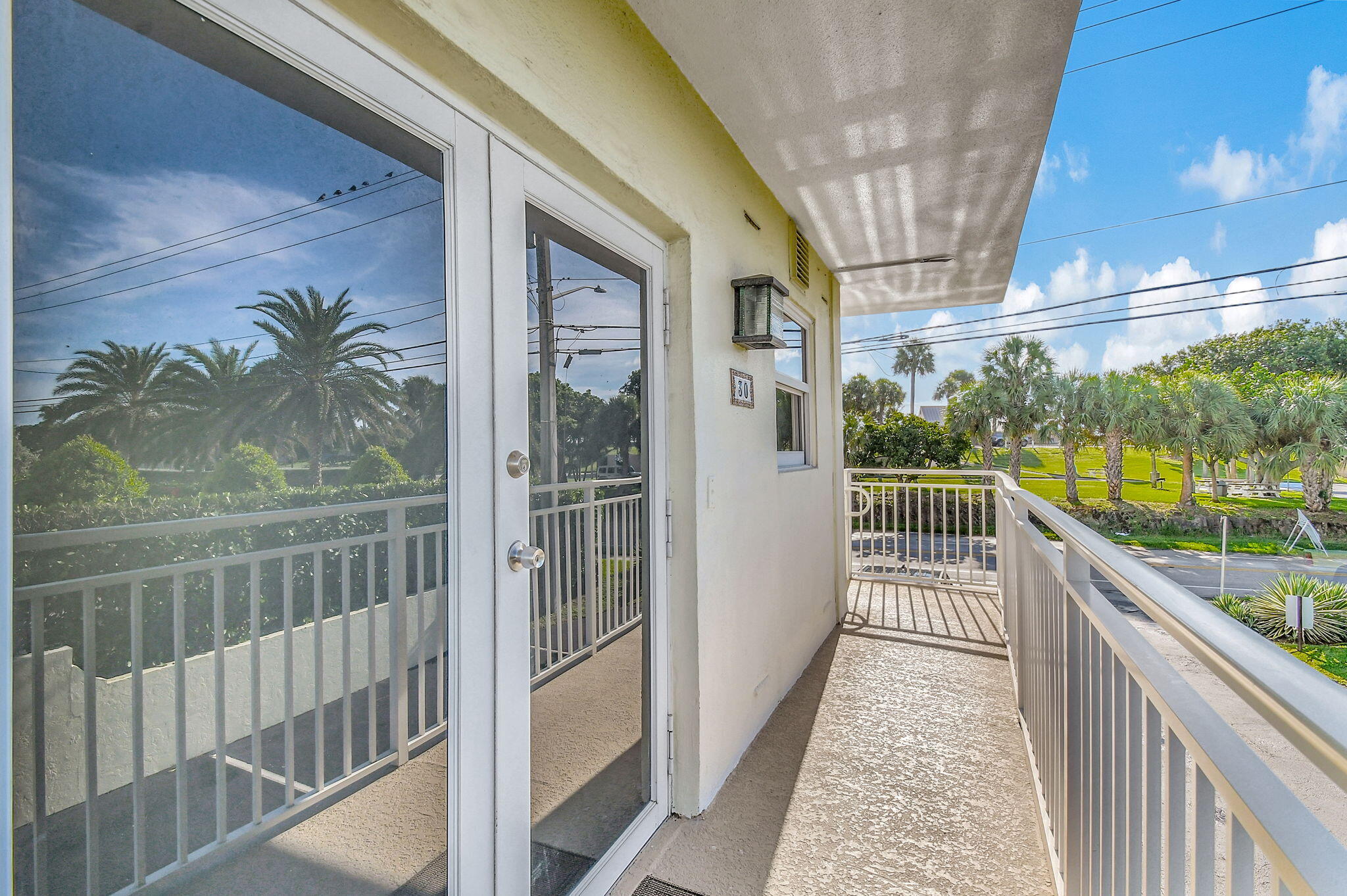 6520 North Ocean Boulevard, Unit 30 Ocean Ridge, FL 33435 - Photo 13 of 29 a view of balcony with couch