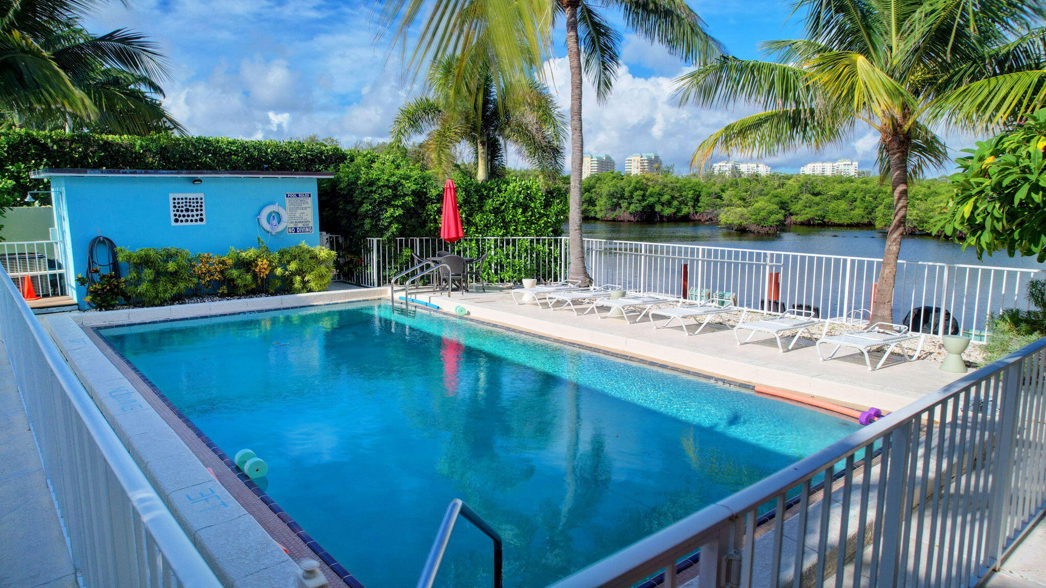 6520 North Ocean Boulevard, Unit 30 Ocean Ridge, FL 33435 - Photo 20 of 29 a view of swimming pool with a table and chairs