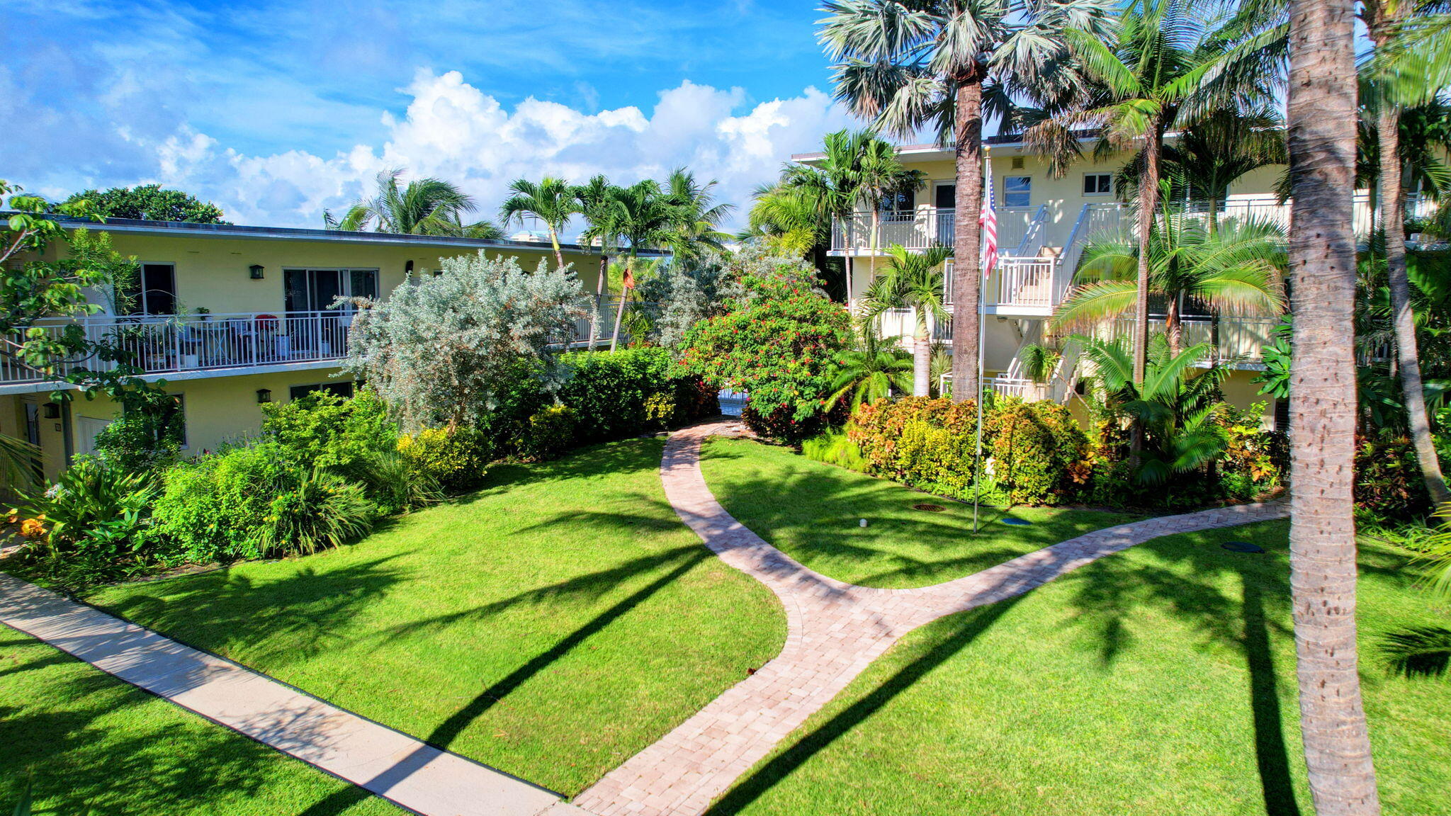6520 North Ocean Boulevard, Unit 30 Ocean Ridge, FL 33435 - Photo 2 of 29 a view of a garden with a fountain
