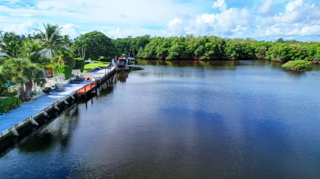 a view of a lake with a house in the background