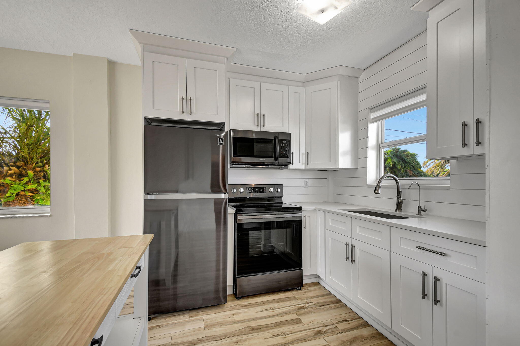 6520 North Ocean Boulevard, Unit 30 Ocean Ridge, FL 33435 - Photo 5 of 29 a kitchen with a sink stove and refrigerator