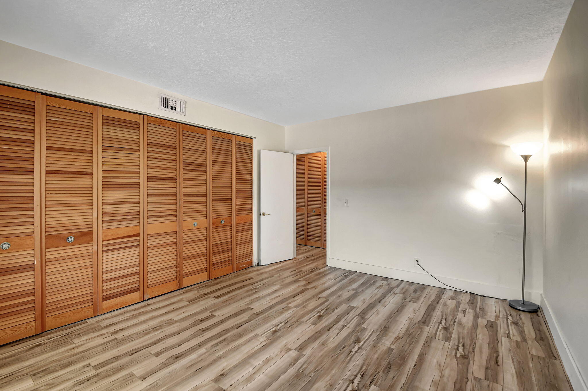 6520 North Ocean Boulevard, Unit 30 Ocean Ridge, FL 33435 - Photo 10 of 29 a view of empty room with wooden floor