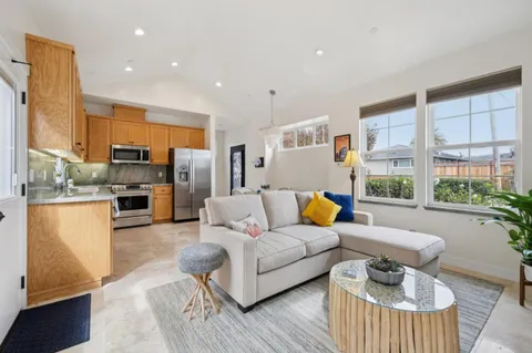 a living room with furniture and a table