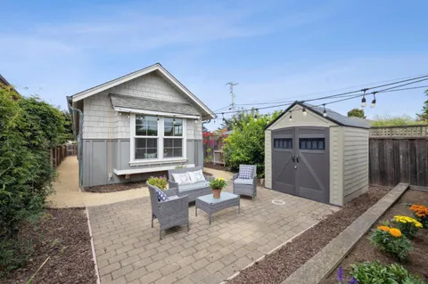 a view of a patio with couches and potted plants