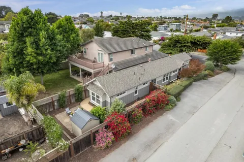 an aerial view of a house with a garden