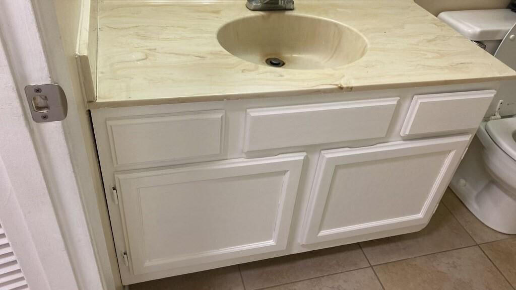 2516 South 19th Street, Unit 208 Fort Pierce, FL 34982 - Photo 3 of 16 a bathroom with a sink and washing machine