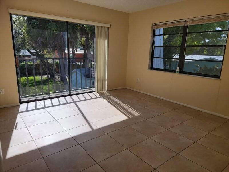 2516 South 19th Street, Unit 208 Fort Pierce, FL 34982 - Photo 10 of 16 a view of an empty room with a window
