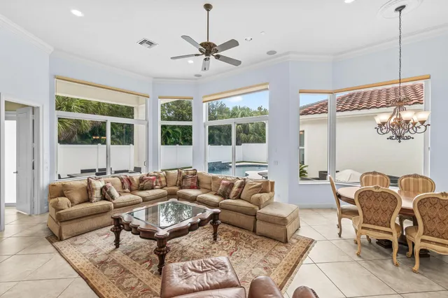 a kitchen with stainless steel appliances granite countertop white cabinets and a sink