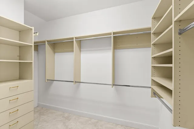 a view of an empty walk in closet