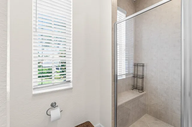 a bed room with a bed and a chandelier