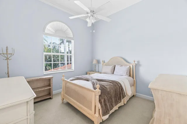 an aerial view of a house with balcony and trees